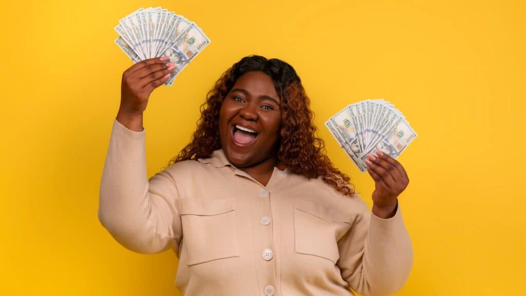 woman with cash dollar banknotes in her hands
