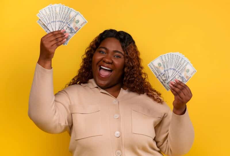 woman with cash dollar banknotes in her hands