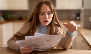 Woman Shocked by High Bills in Kitchen