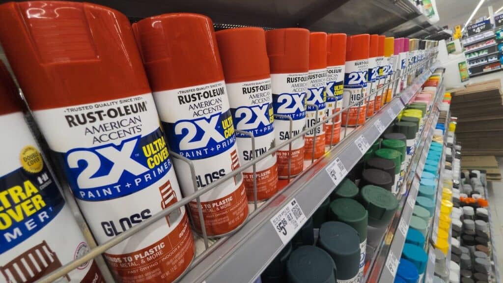Red Rust-Oleum Brand Spray Paint Cans on Store Shelf at Walmart