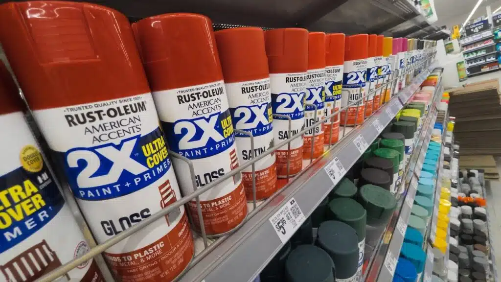 Red Rust-Oleum Brand Spray Paint Cans on Store Shelf at Walmart