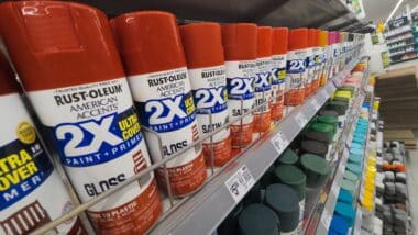 Red Rust-Oleum Brand Spray Paint Cans on Store Shelf at Walmart