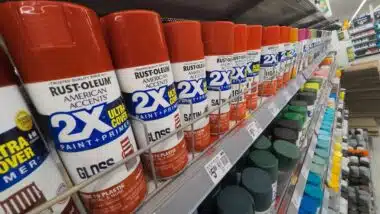 Red Rust-Oleum Brand Spray Paint Cans on Store Shelf at Walmart