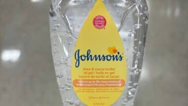 a bottle of Johnson's shea and cocoa butter oil gel in a store
