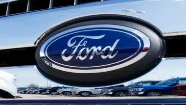 Local Ford Car and Truck Dealership, reflected of Ford logo