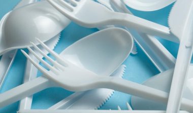 Plastic cutlery, forks, spoons and knives.