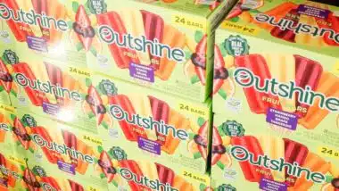 A view of several cases of Outshine fruit bars, on display at a local big box grocery store.