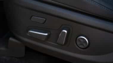 Electric car seat adjustment control panel close up view