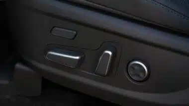 Electric car seat adjustment control panel close up view