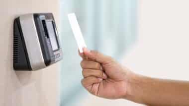 Proximity card reader door unlock, Hand security man using ID card on fingerprint scanning access control system for identity verification to open the door or for security safety or check attendance.