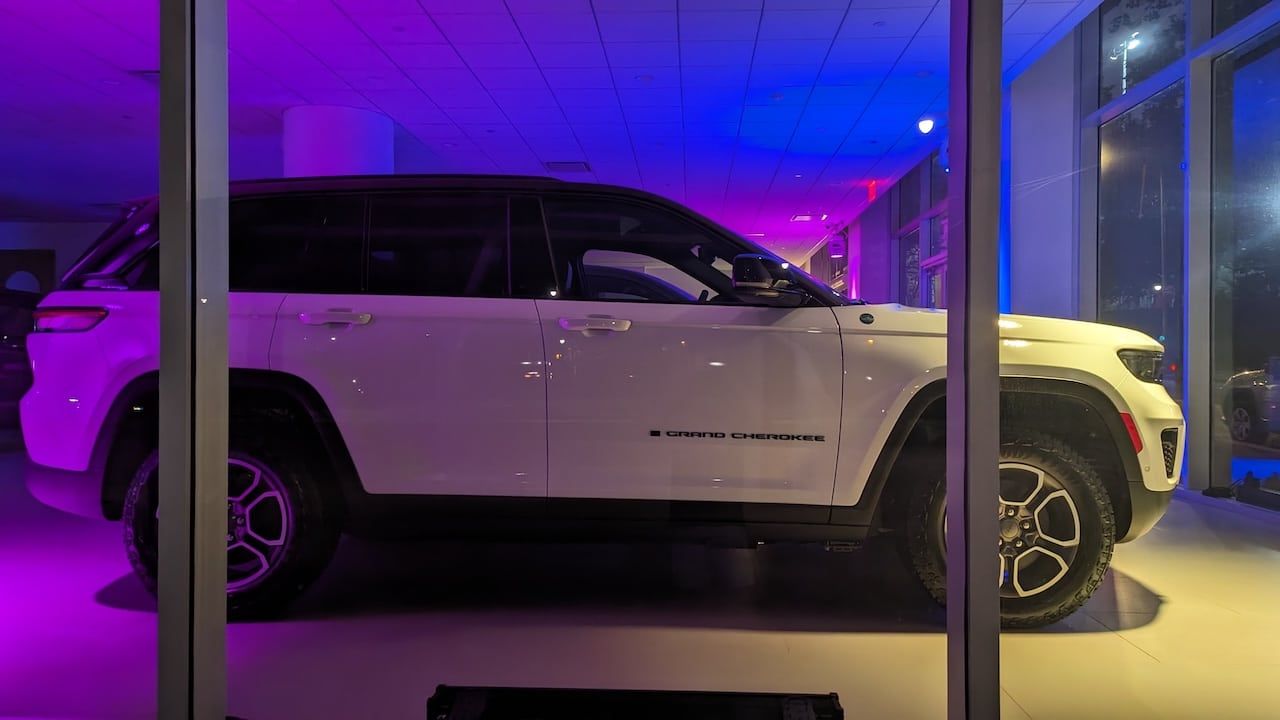 2023 Jeep Grand Cherokee illuminated display at a car dealership