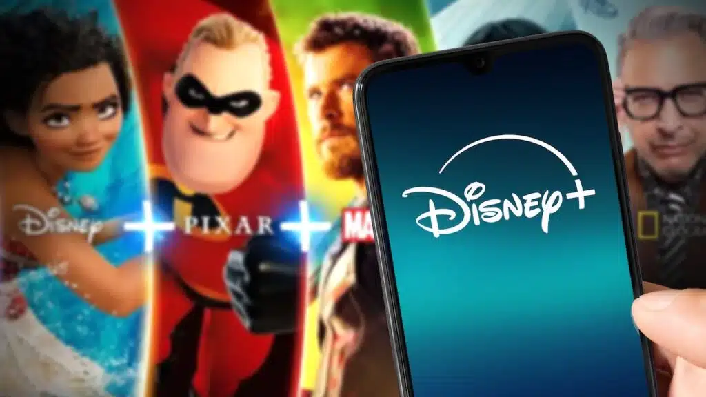Smartphone with new Disney Plus logo with Disney Plus content on background