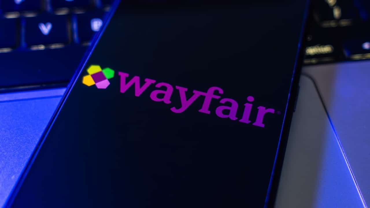 Wayfair e-commerce marketplace logo on the phone screen