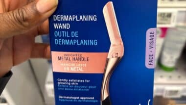 Schick Hydro Silk dermaplaning wand for the face in a store.