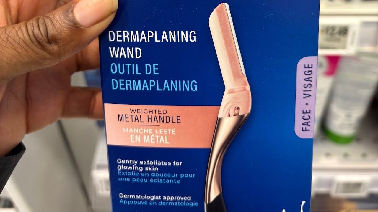 Schick Hydro Silk dermaplaning wand for the face in a store.