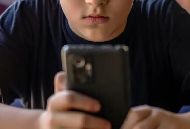 Child gadget addiction. Child, teenager or preteen mobile phone. Mobile addiction, digital dependence concept.