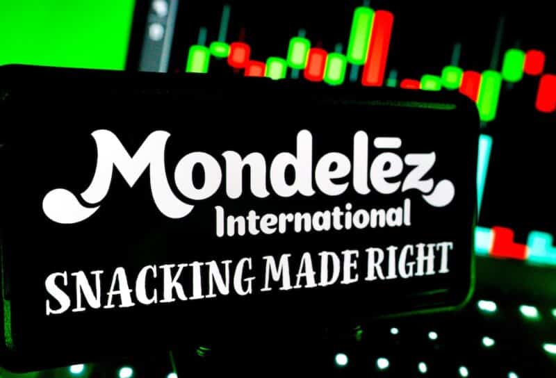 Mondelez International Company Logo Branding on Screen with Stock Chart Market Trends in Background with LED Vibrant Lighting