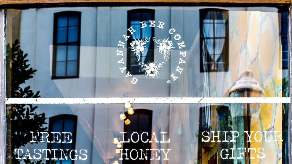 Savannah bee company logo on window