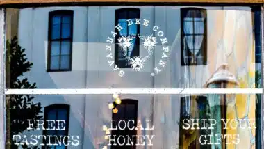 Savannah bee company logo on window