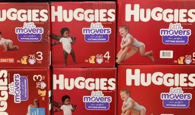 Boxes of Huggie's Little Movers diapers on display on a grocery store shelf