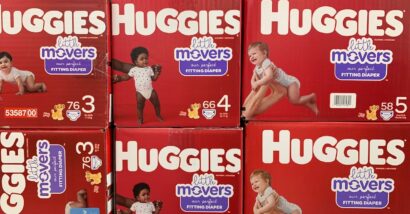 Boxes of Huggie's Little Movers diapers on display on a grocery store shelf