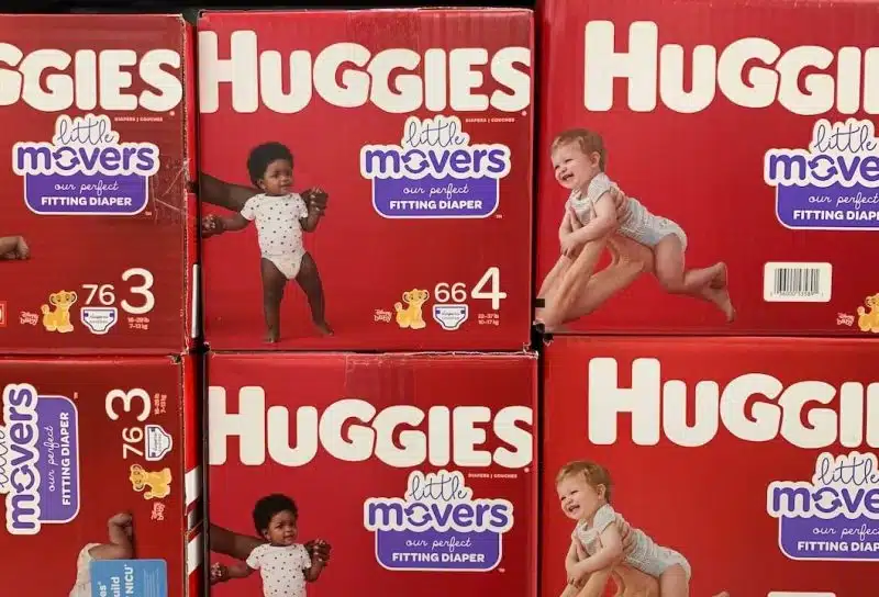 Boxes of Huggie's Little Movers diapers on display on a grocery store shelf