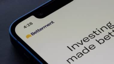 Closeup of Betterment logo seen on its app login page on an iPhone.