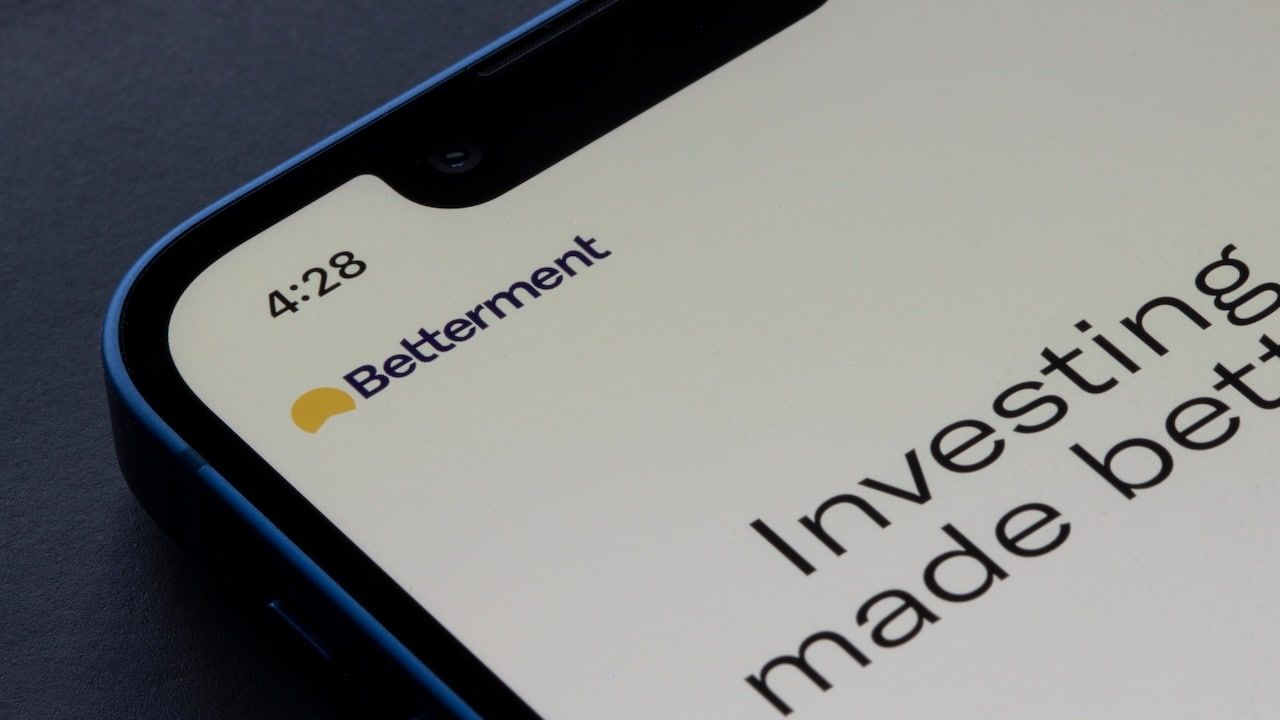 Closeup of Betterment logo seen on its app login page on an iPhone.