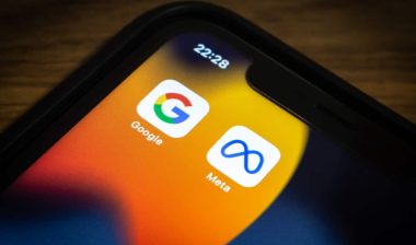 Closeup icons of Google and Meta on an iPhone
