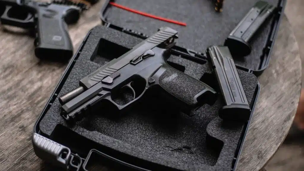 Sig Sauer P320 pistol on a wooden table