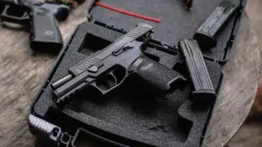 Sig Sauer P320 pistol on a wooden table