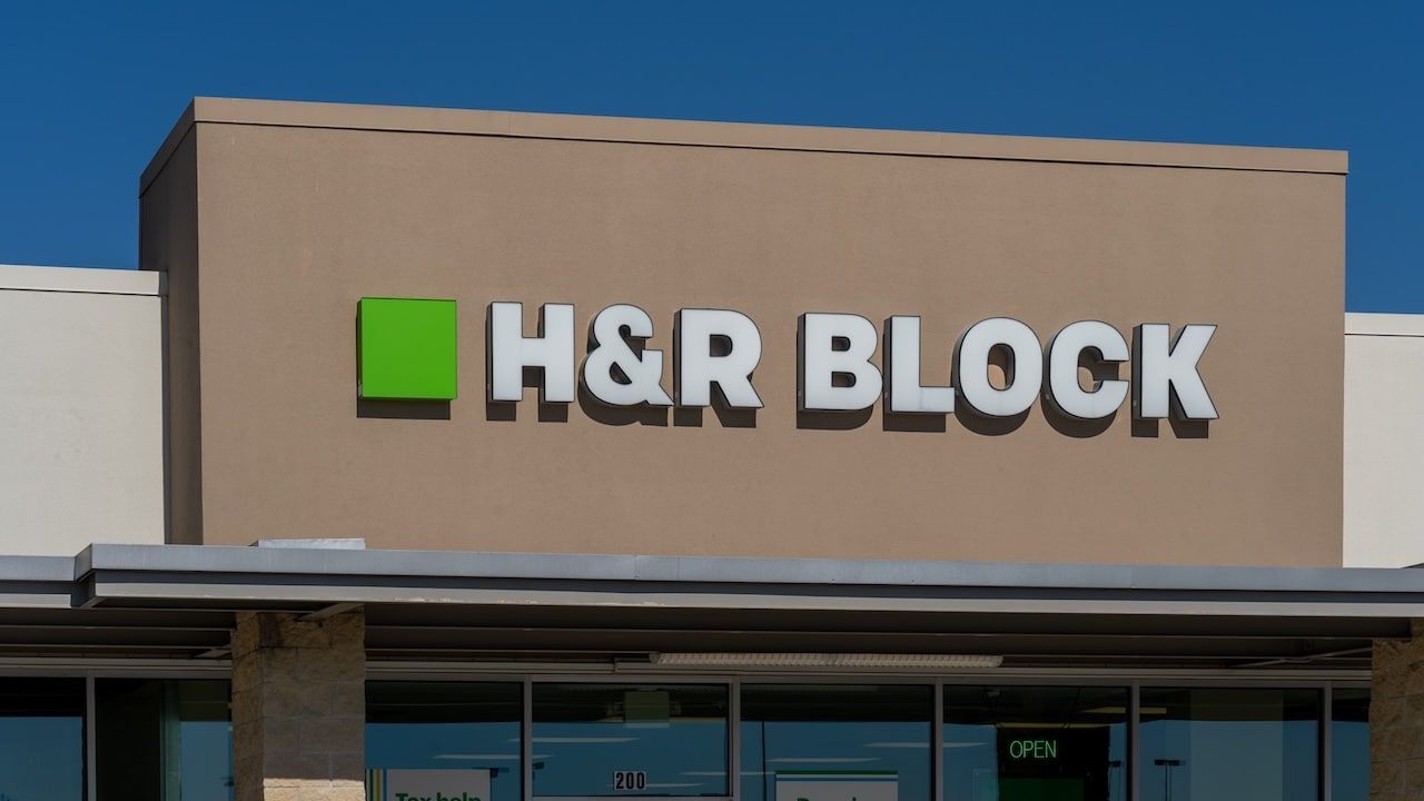 Close up of H and R Block office sign on the building.