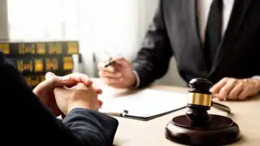 lawyer and client discuss the lawsuit