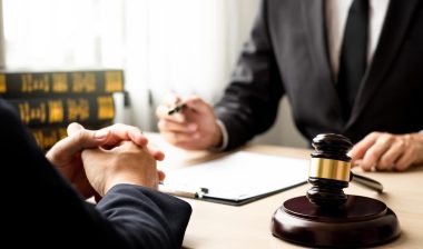 lawyer and client discuss the lawsuit