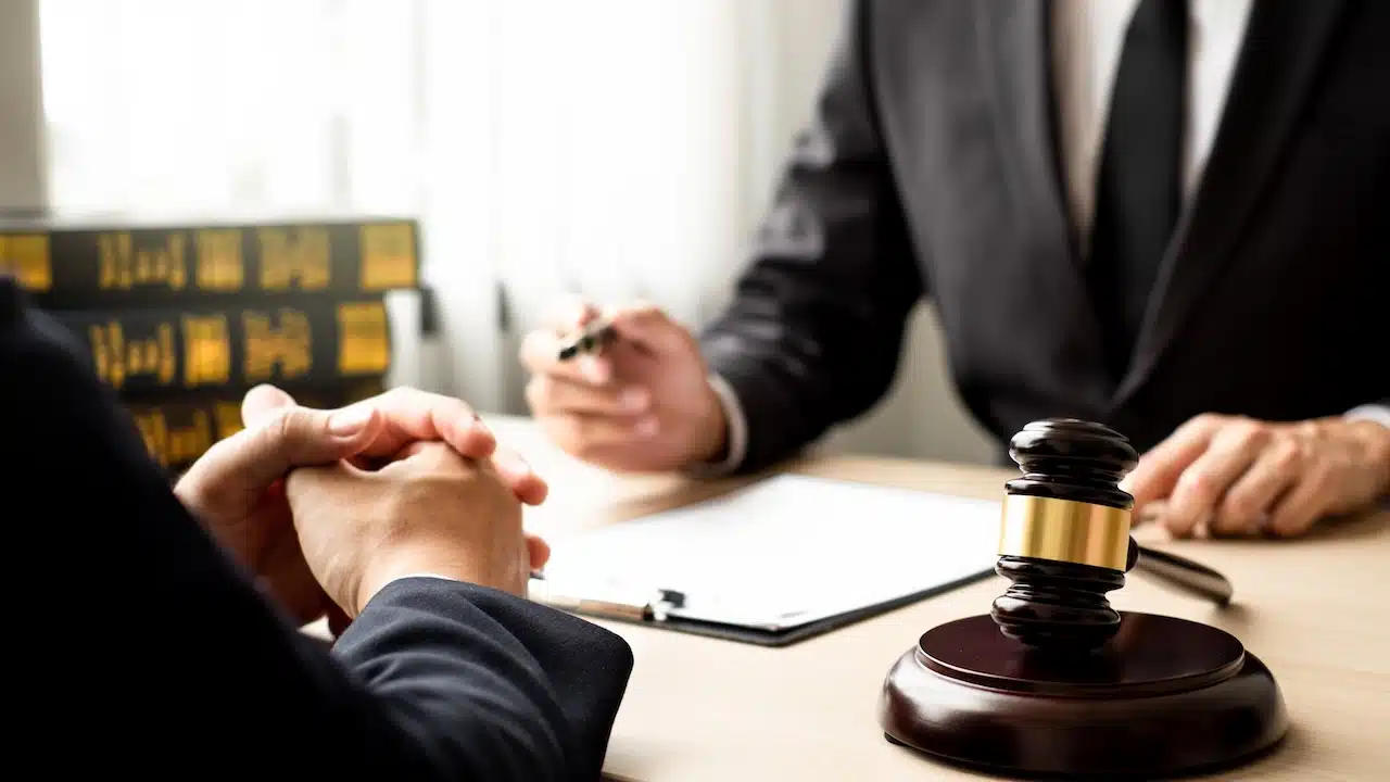 lawyer and client discuss the lawsuit