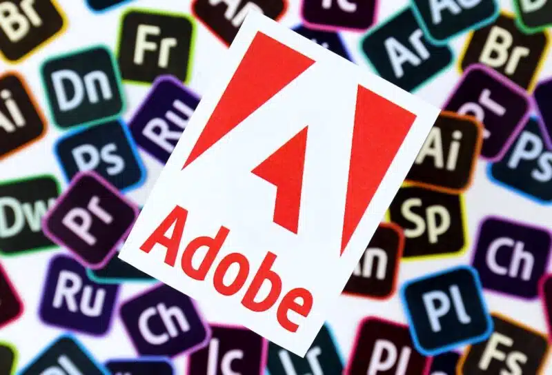 Paper logos of most popular adobe products on white background.