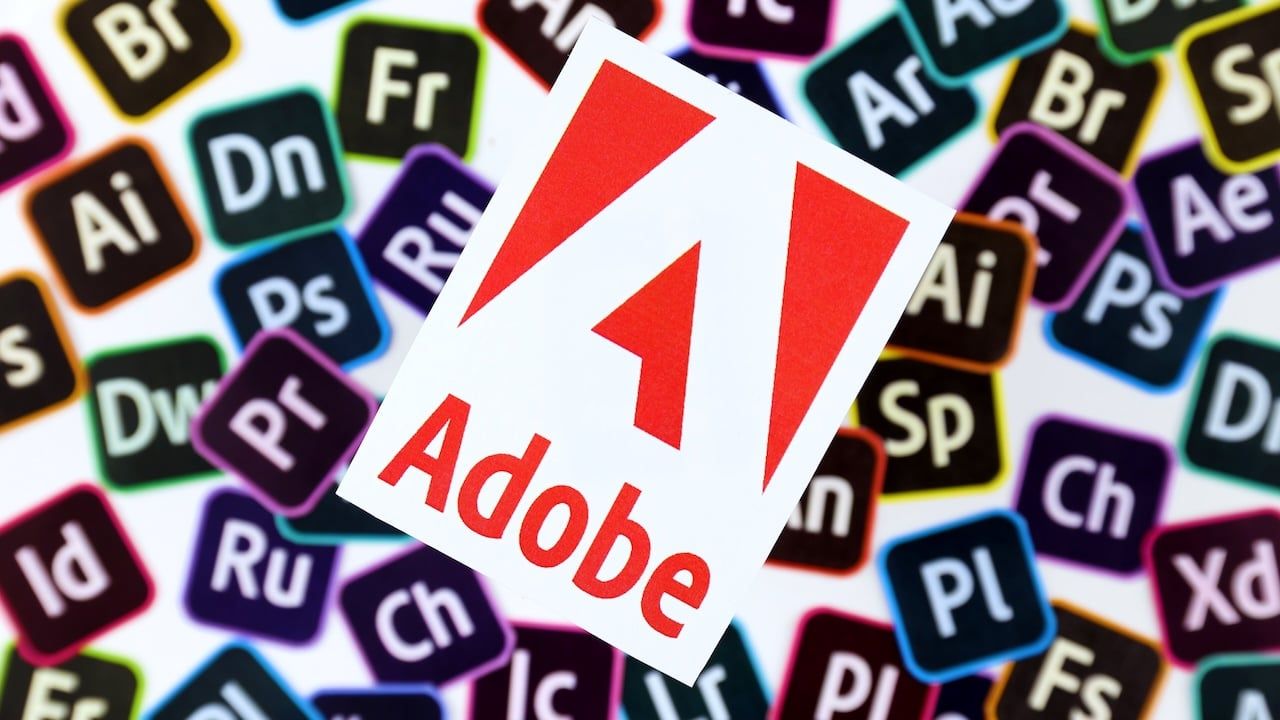 Paper logos of most popular adobe products on white background.