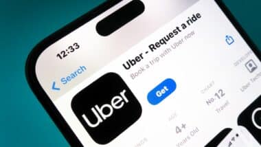 Uber app on a smartphone. Uber is a taxi like technology company.
