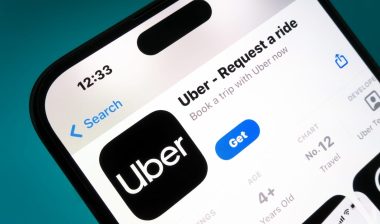 Uber app on a smartphone. Uber is a taxi like technology company.