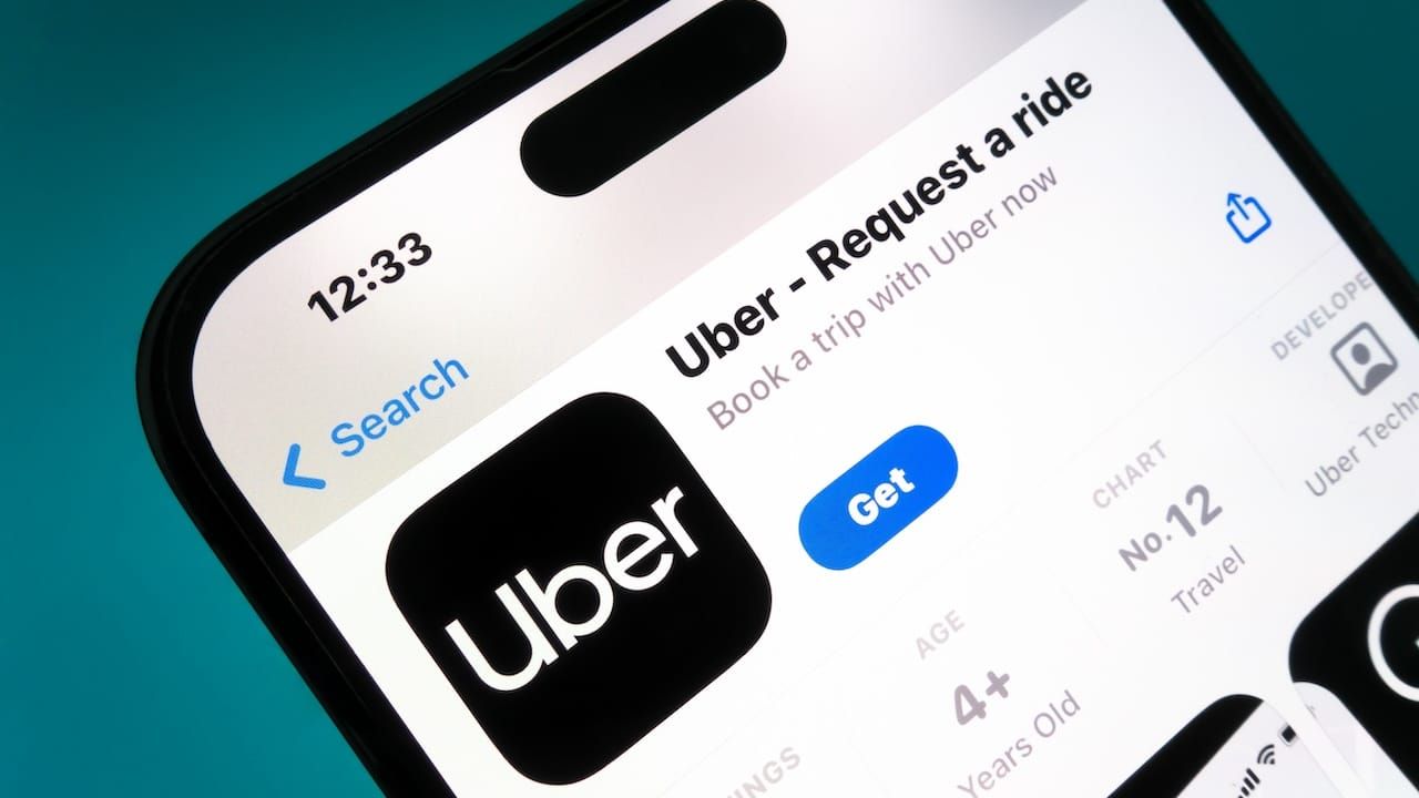 Uber app on a smartphone. Uber is a taxi like technology company.