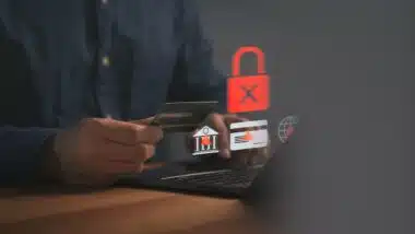 Cybercrime and bank fraud concept on laptop.