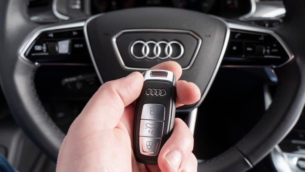 Close up of Audi A6 car keys in driver hand.