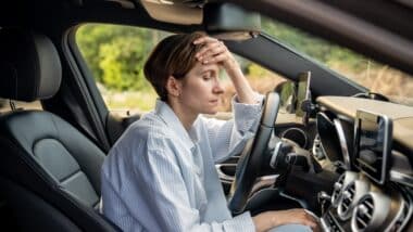 woman stopped after driving car.