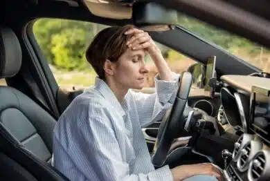 woman stopped after driving car.