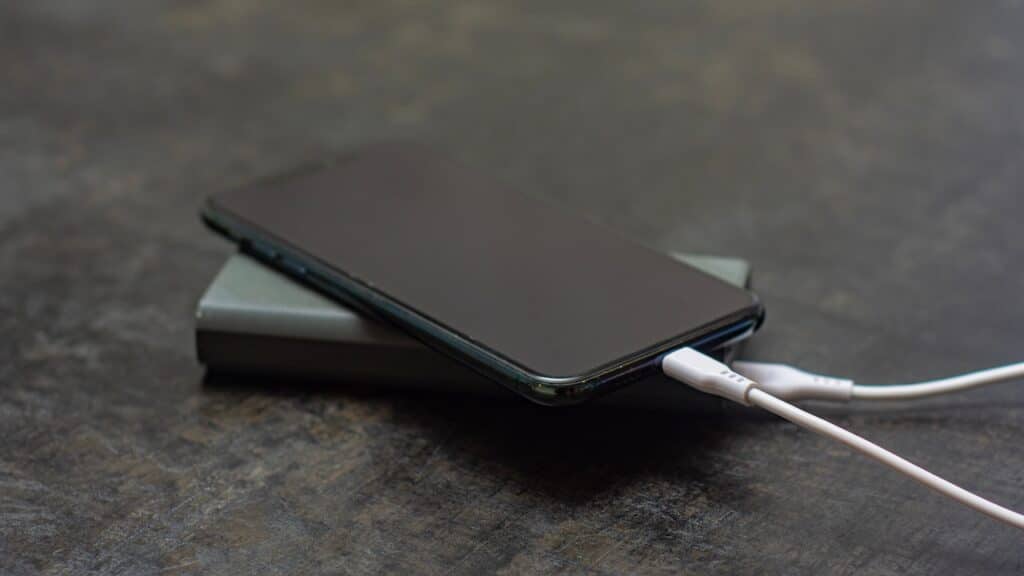 Portable charger charges a smartphone