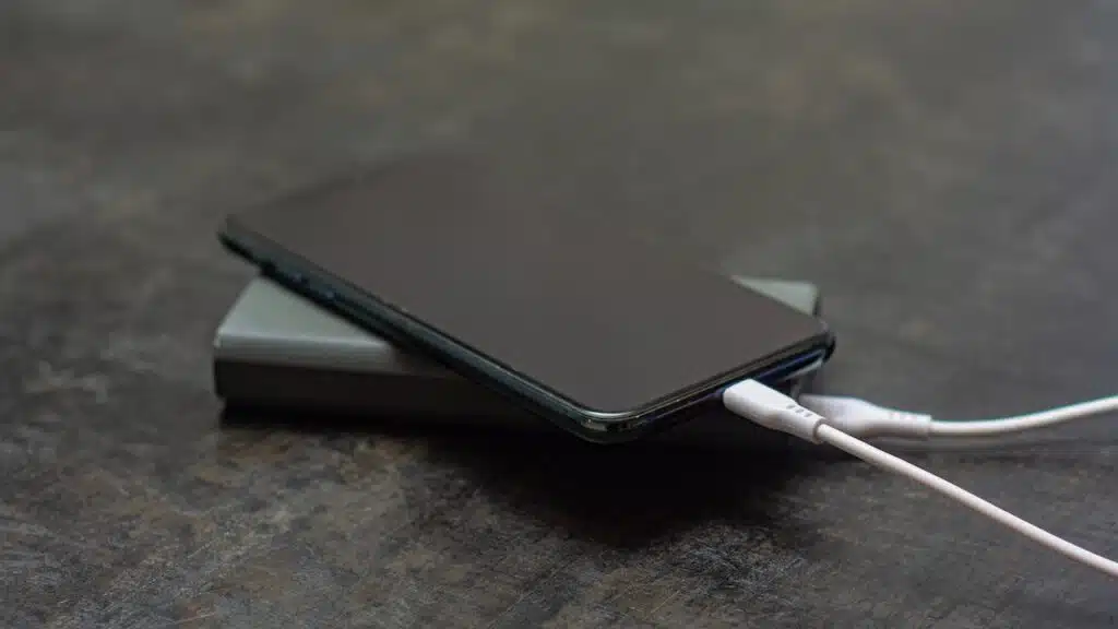 Portable charger charges a smartphone