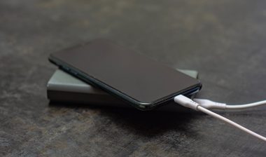 Portable charger charges a smartphone