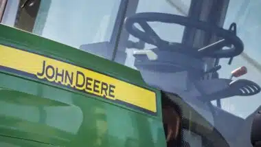 Front of tractor with John Deere logo.