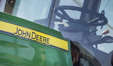 Front of tractor with John Deere logo.