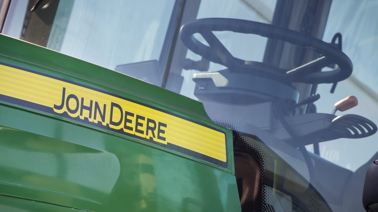 Front of tractor with John Deere logo.